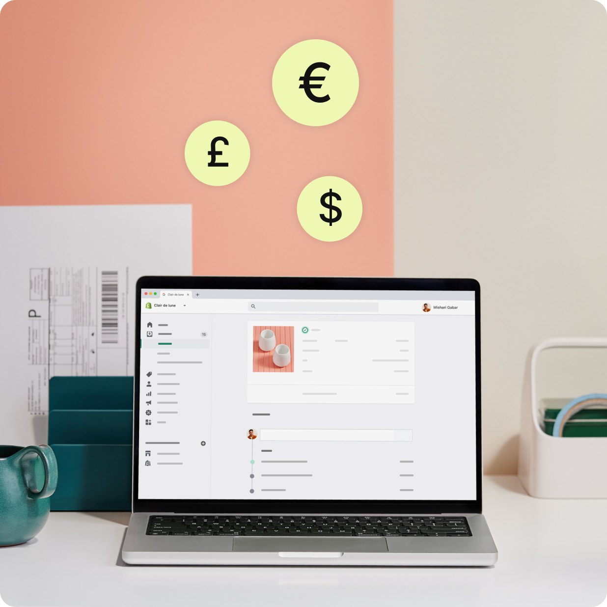 Portátil que muestra pedidos y facturas de Shopify Payments con varios símbolos de moneda.