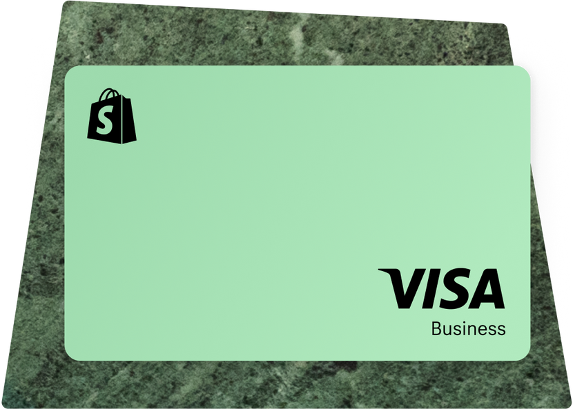 A mint green Shopify business credit card featuring the black Shopify shopping bag logo in the top left corner and 'VISA Business' branding in black text in the bottom right corner against the clean, minimalist card design.