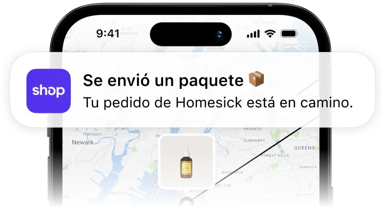 Un teléfono móvil que muestra una notificación de la aplicación Shop en la que se indica que se ha enviado un paquete de Homesick, con un mapa de seguimiento detrás