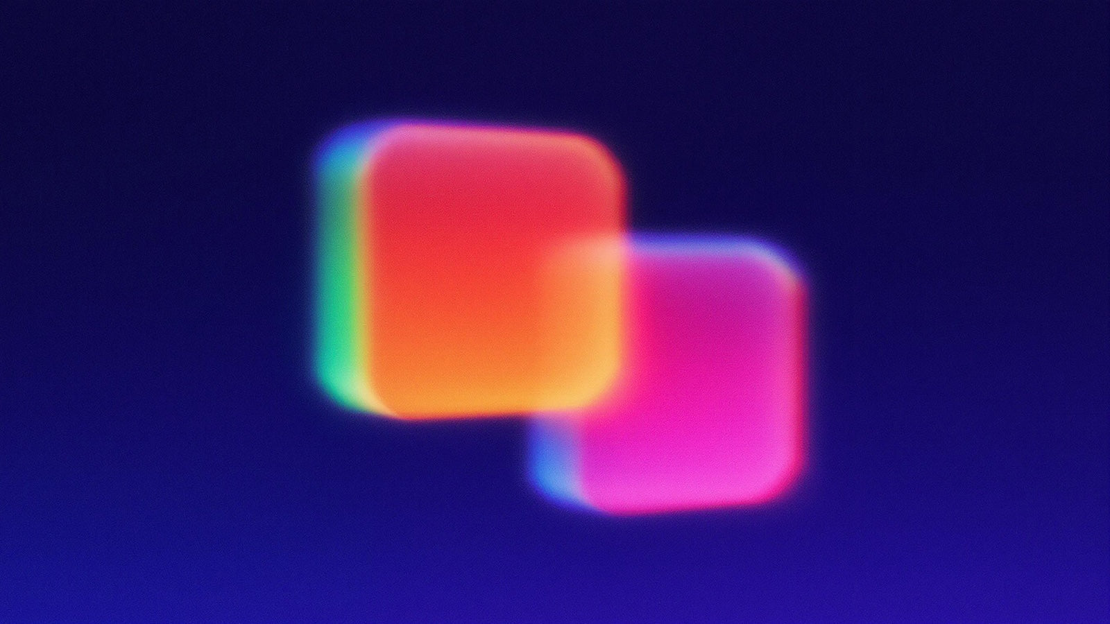 Blurred, glowing rounded squares overlapping on a dark grainy background